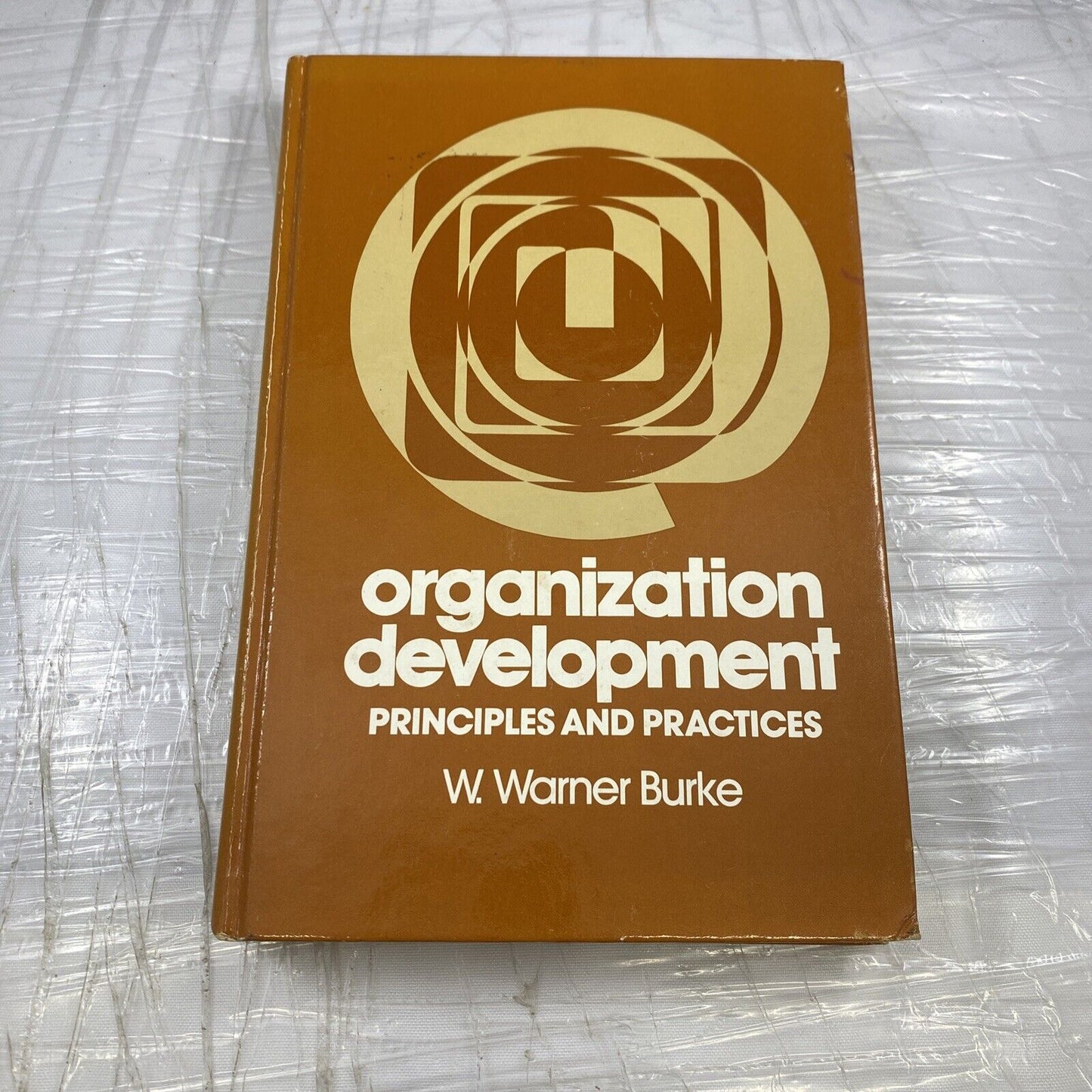 Organization development: Principles and practices Vintage 80s Textbook Orange