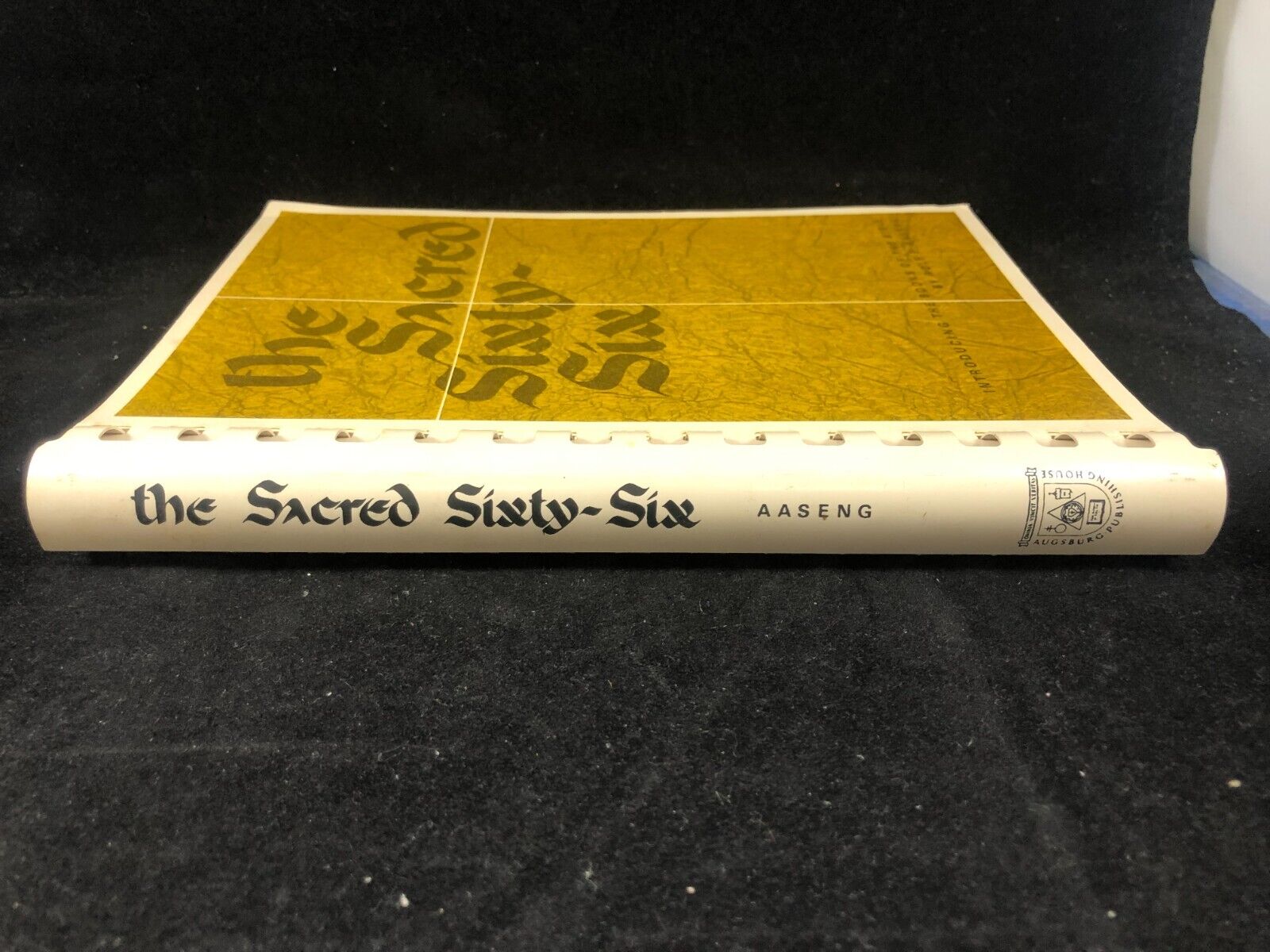 The Sacred Sixty-Six Rolf E. Aaseng Spiral Christian book